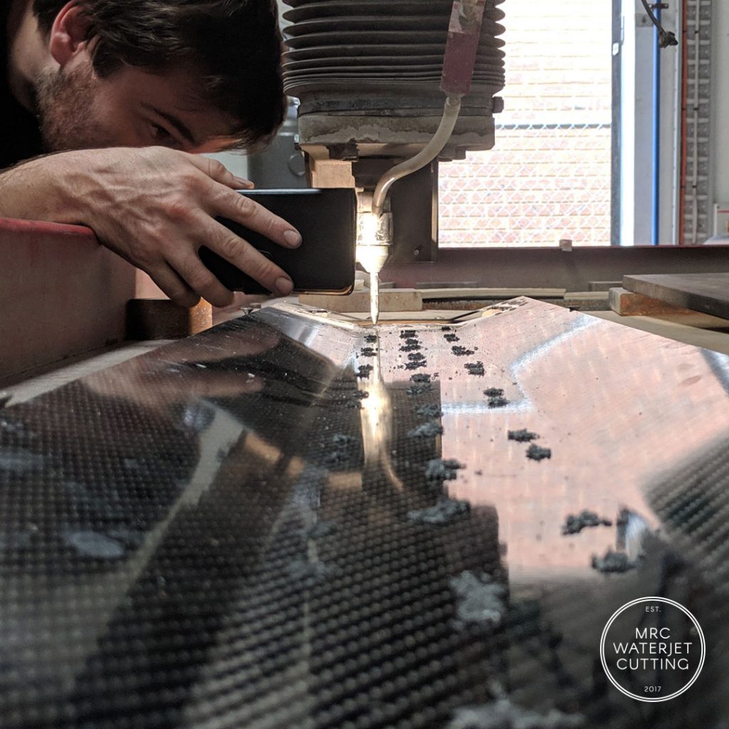 Waterjet cutting 3d carbon fibre parts.